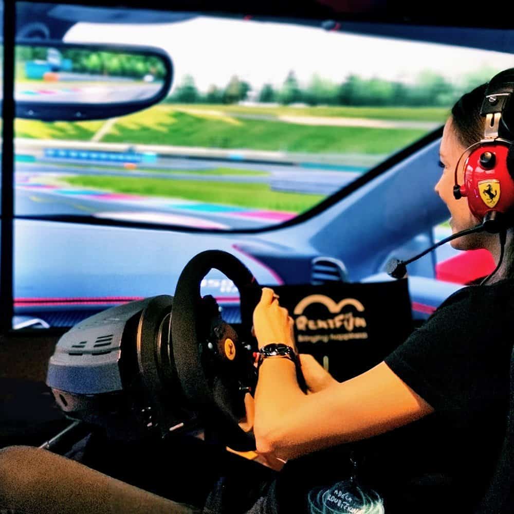 Premium racing simulator rental with FIA-licensed motion platform at IT conference for Semrush..
