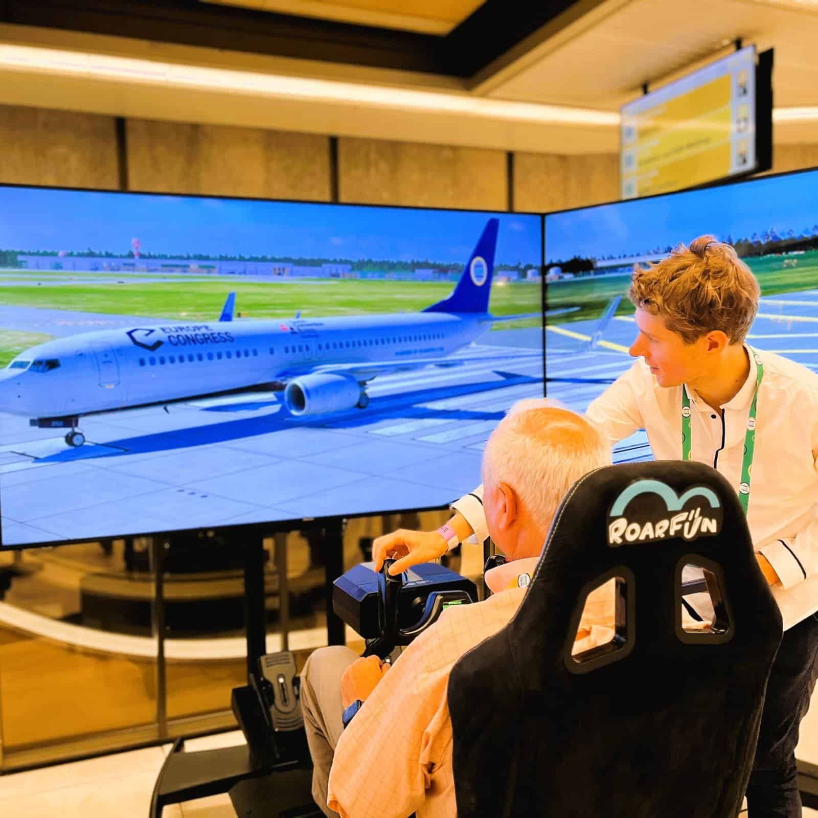 Support shows how to operate flight simulator.