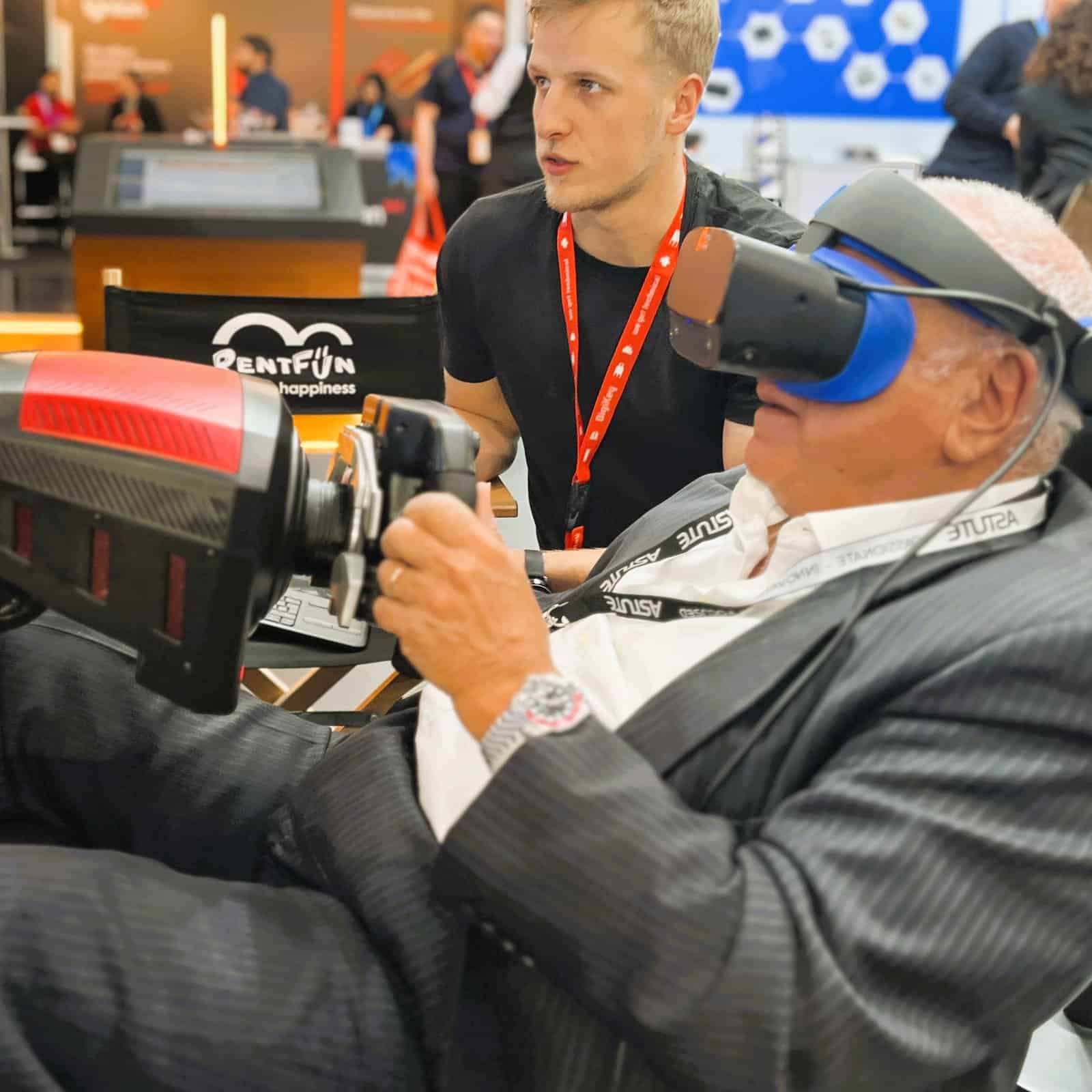 Business person in VR motion racing simulator rental.