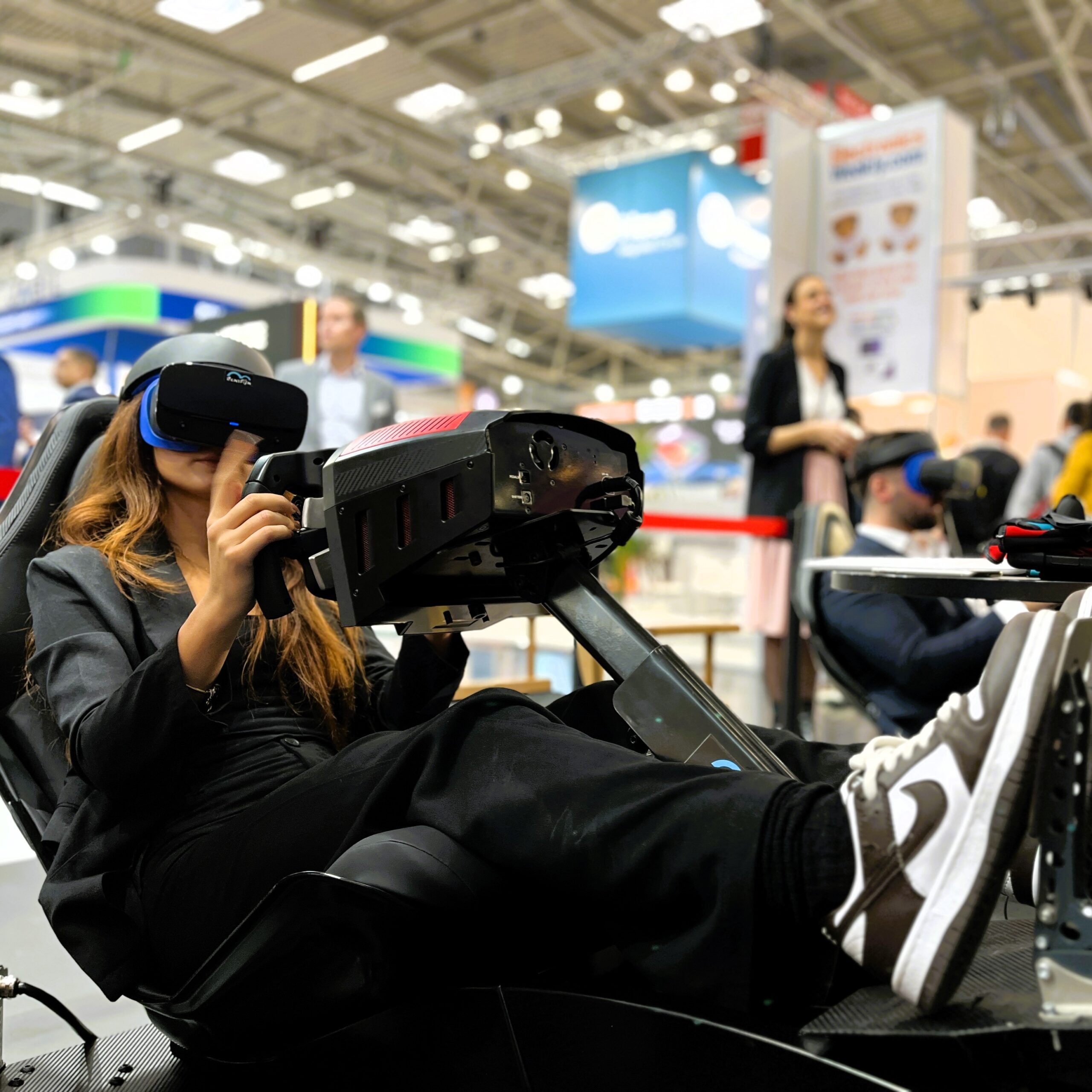 Hot Girl in virtual reality with mobile racing simulator rental in Munich.