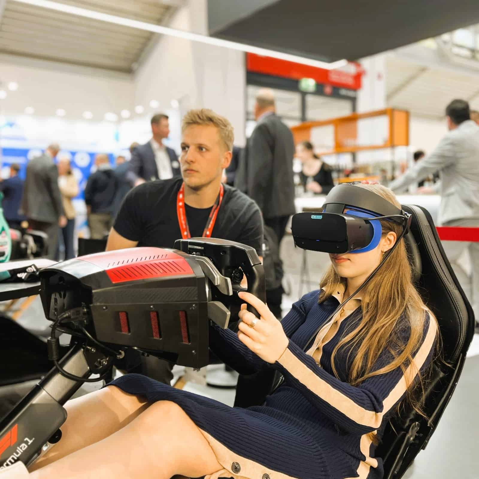 Happy girl in VR on a Formula motion simulator in Munich.